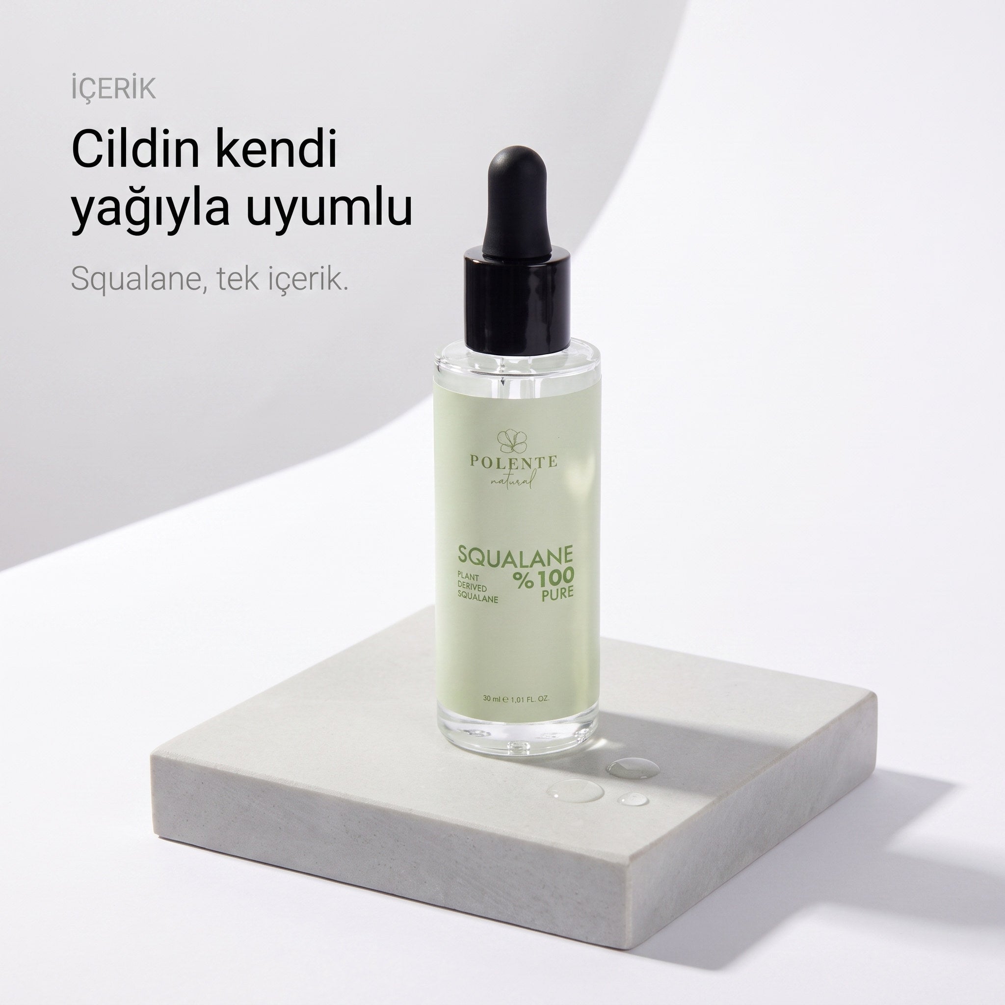 %100 Pure Squalane 30 ml — cildin kendi yağıyla uyumlu, taş kaide üzerinde