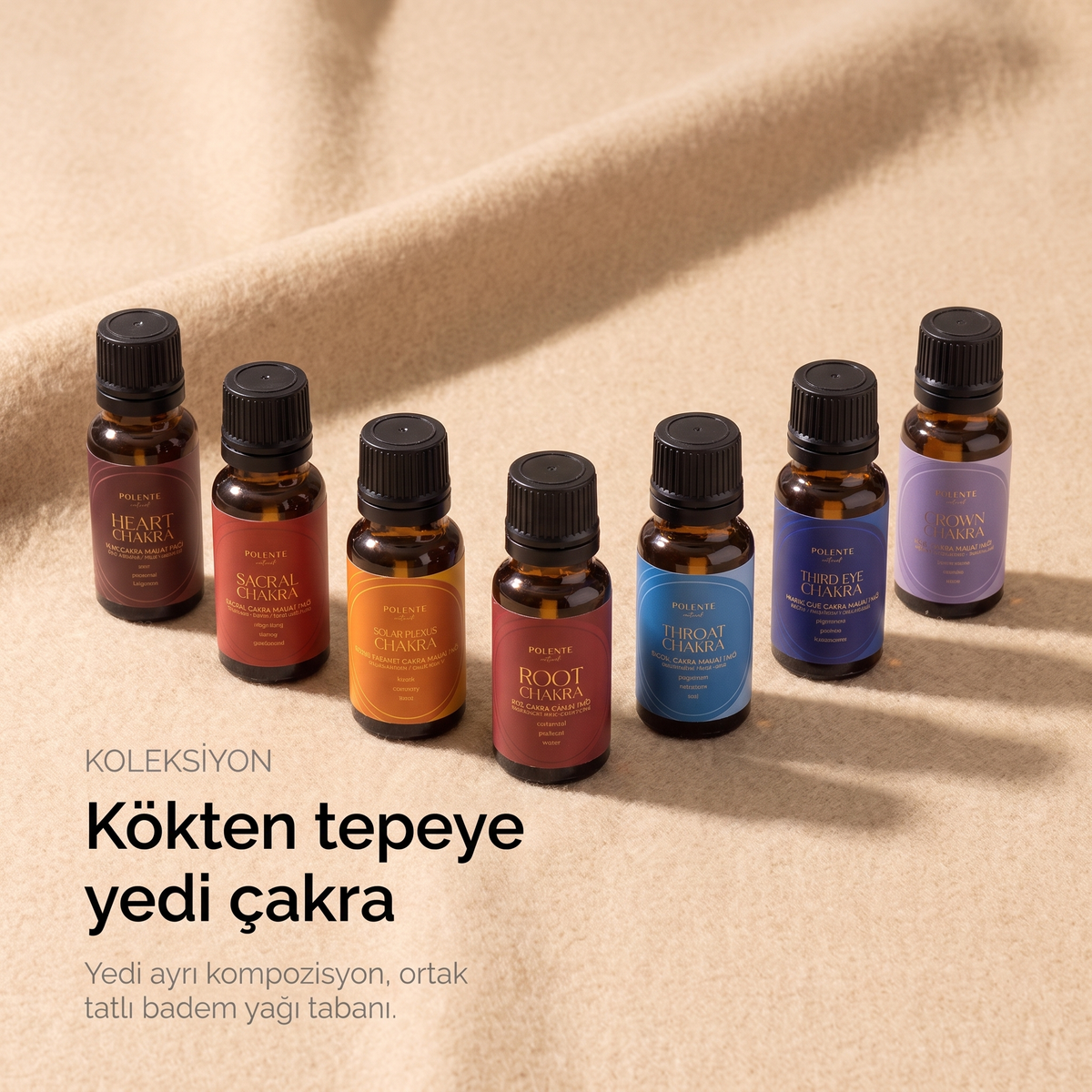 Chakra Ritual Collection kompozisyonu — kökten tepeye yedi aromatik yağ, ortak tatlı badem yağı tabanı