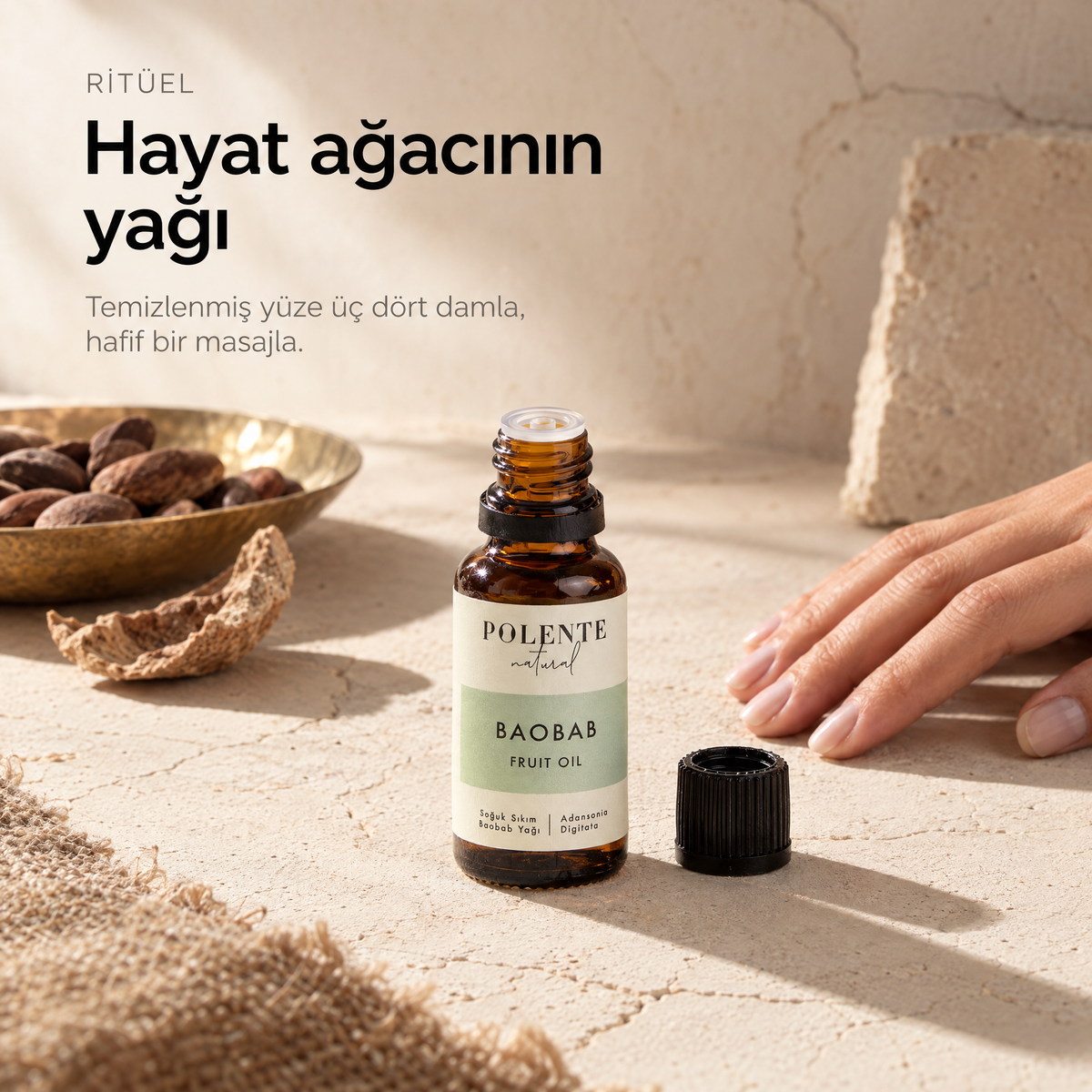 Baobab Yağı 30 ml — sabah ritüeli, kapağı açılmış cam şişe yanında duran el