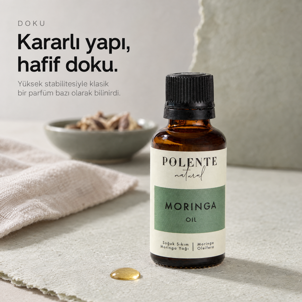 Moringa Yağı 30 ml — yağın dokusu, yüzeydeki tek damlanın makro çekimi