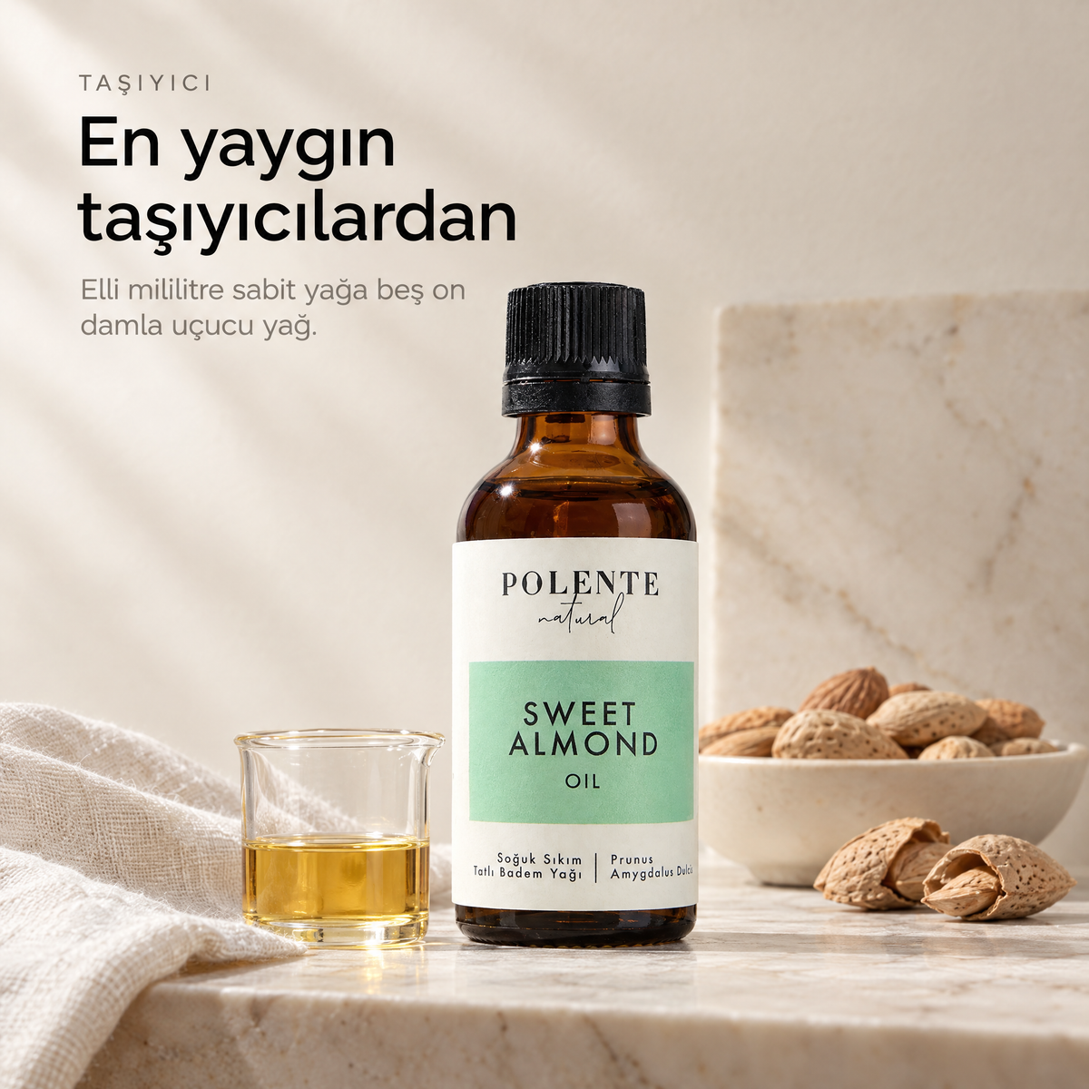 Tatlı Badem Yağı 50 ml — taşıyıcı yağ, cam beher içinde berrak altın rengi yağ