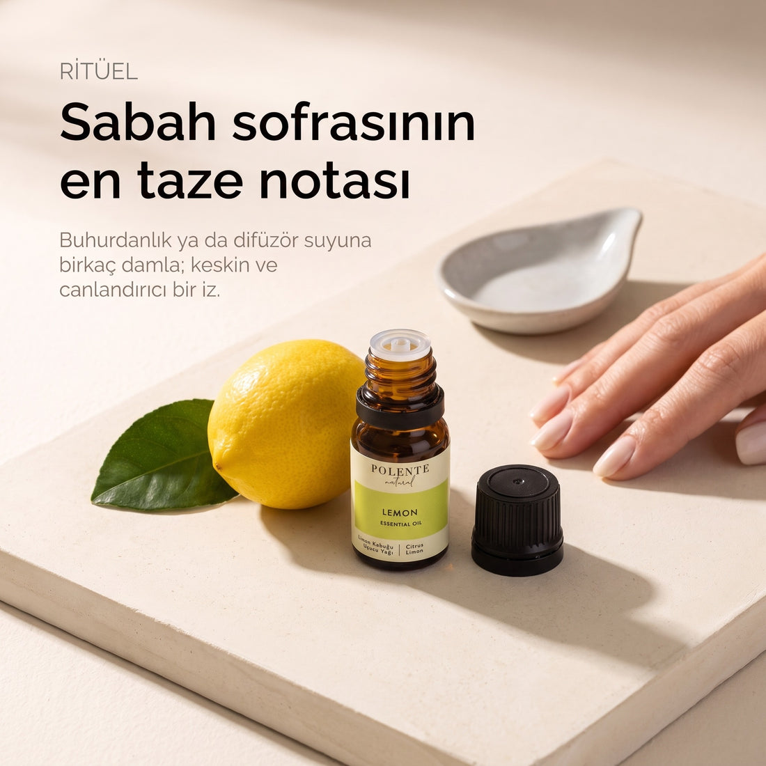 Limon Kabuğu Uçucu Yağı 10 ml — buhurdanlık ritüeli, krem mikro-beton yüzeyde açık şişe ve limon