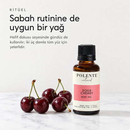 Vişne Çekirdeği Yağı 30 ml — sabah rutinine de uygun, mermer tezgâhta şişe ve vişneler