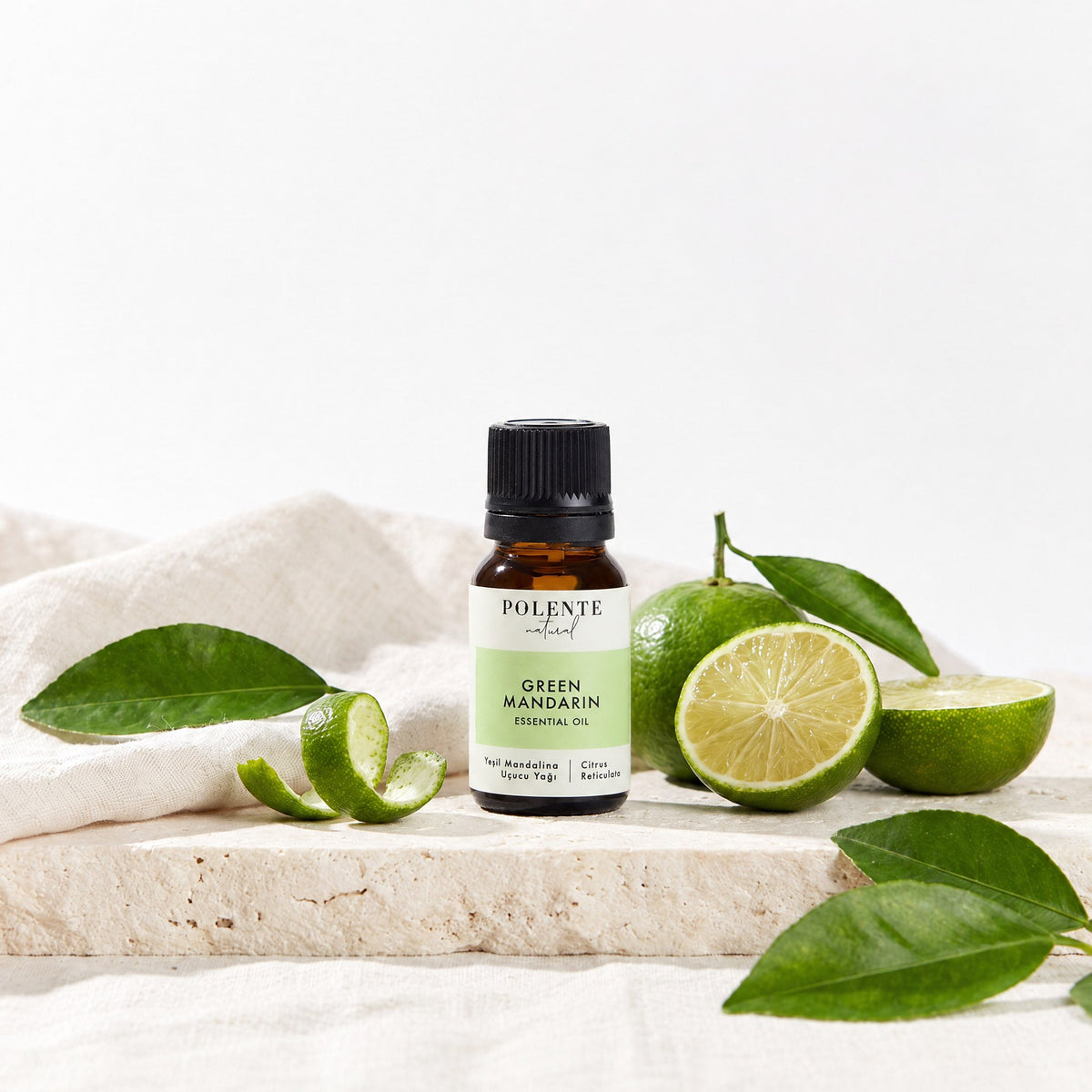 Yeşil Mandalina Uçucu Yağı 10 ml — yeşil mandalina ve yapraklarıyla botanik konsept görseli